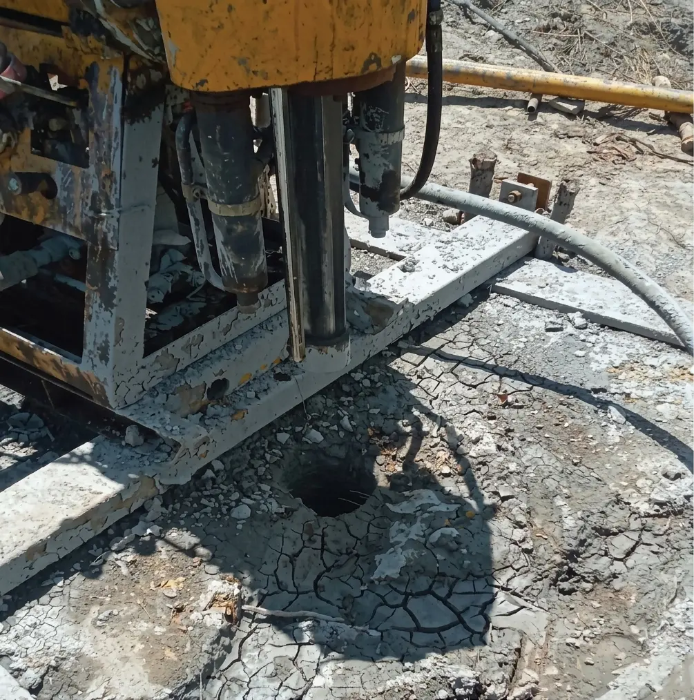 Underground mine tunnel with heavy machinery, dark rock walls, industrial lighting casting gold tones, deep mine shaft atmosphere